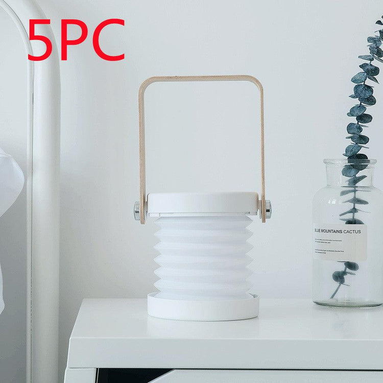 Portable lantern lamp USB rechargeable on a table with minimalist decor.