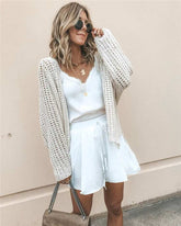 White street-style cardigan sweater with plain pattern, suitable for European and American fashion.