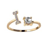 Elegant adjustable ring with initial letter and zircon, fashionable jewelry design for women.