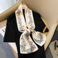 Fashionable Stylish Artificial Silk Ornament Scarf Hair Band with elegant floral pattern displayed on a black outfit.