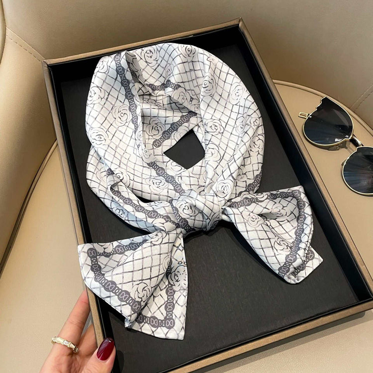 Fashionable stylish artificial silk ornament scarf hair band with elegant floral pattern in a gift box.