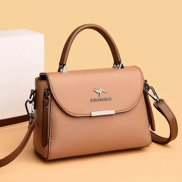 Fashionable stylish women's crossbody shoulder bag in camel color with sleek design and durable leather material.