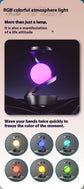 Rotating hanging mobile phone wireless charging lamp with RGB atmosphere lighting.