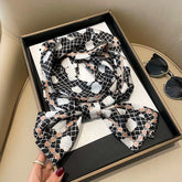 Fashionable stylish artificial silk ornament scarf hair band with floral pattern in black gift box.