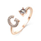 Adjustable rose gold ring with zircon initial letter and diamond accent.