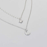 Double-layer moon and star necklace in white gold, clavicle chain design for women.