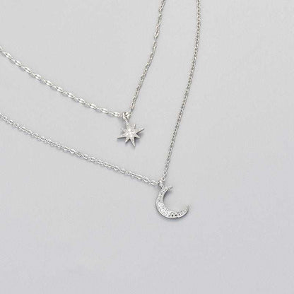 Double-layer moon and star necklace in white gold, clavicle chain design for women.