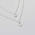 Double-layer moon and star necklace in white gold, clavicle chain design for women.