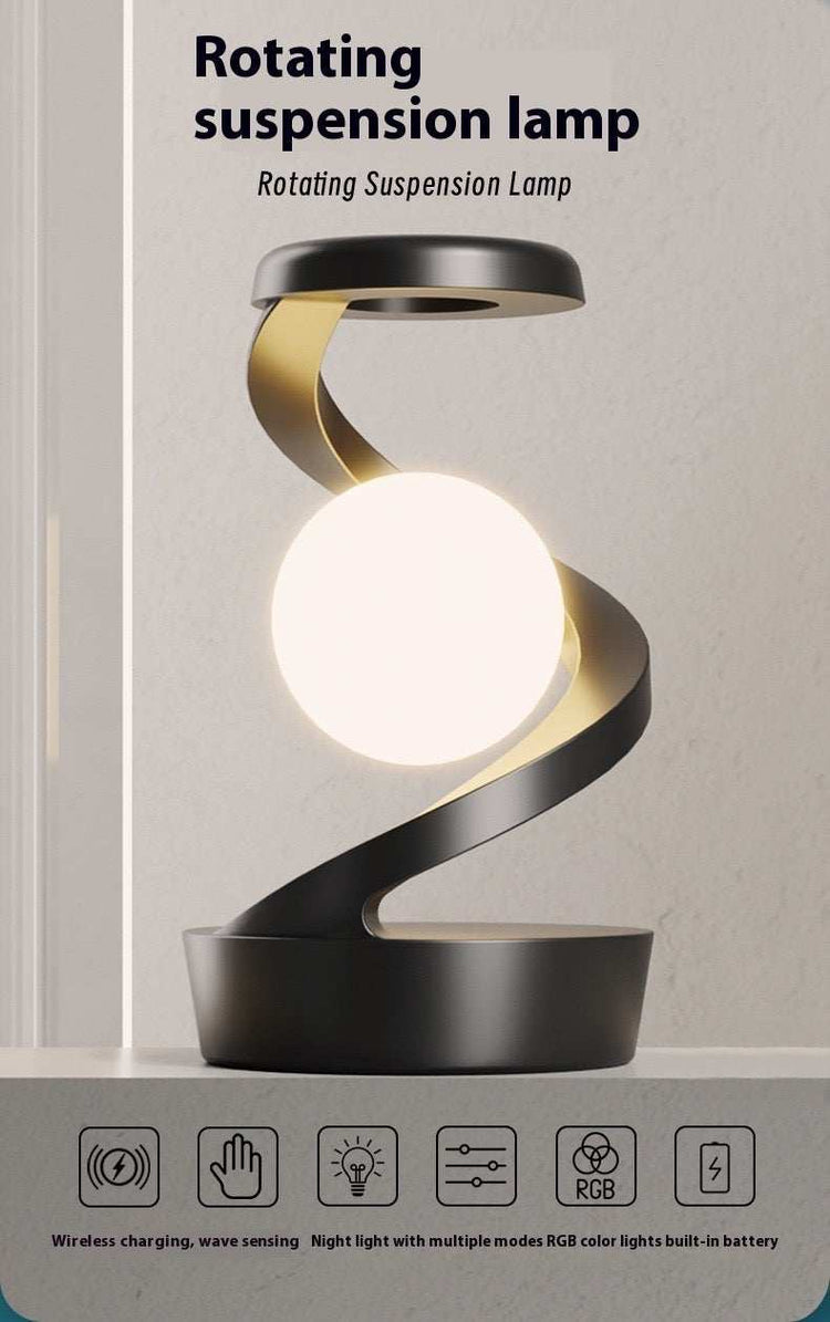 Rotating hanging mobile phone wireless charging lamp.