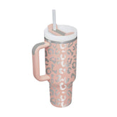 Insulated thermos cup with handle and straw in a stylish design, perfect for temperature retention.