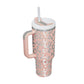 Insulated thermos cup with handle and straw in a stylish design, perfect for temperature retention.