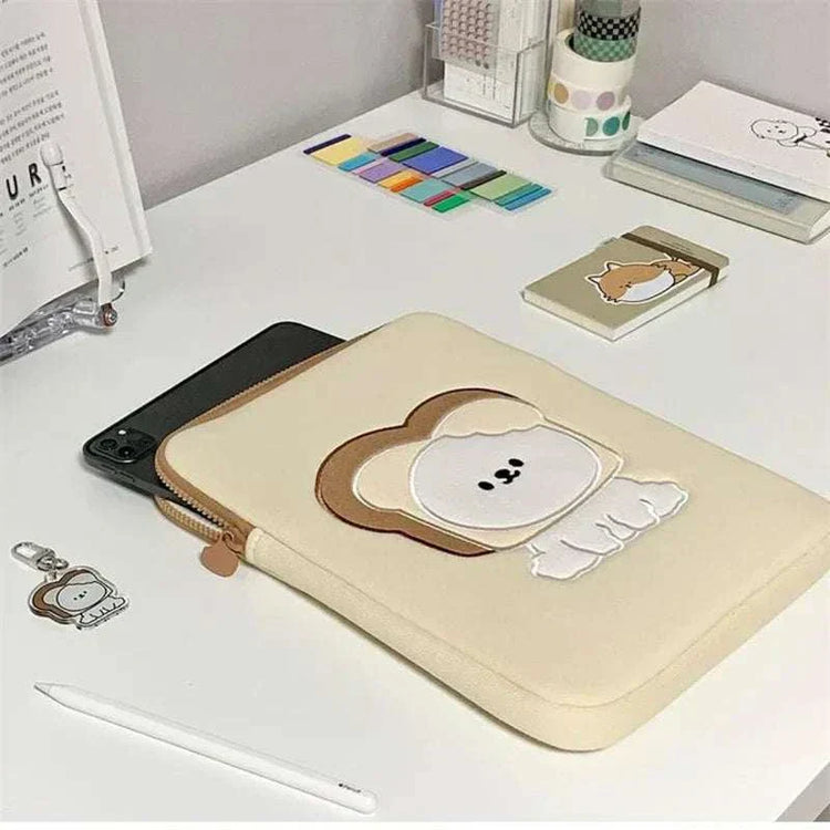 Women cute laptop sleeve case with cartoon design on a desk.