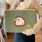 Cute hedgehog laptop sleeve case held by a woman, featuring a protective pouch design.