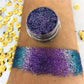 Chameleon eyeshadow with shimmering pigments in purple and teal swatch on arm.