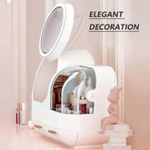 Cosmetic display case with touch screen LED light, clear compartments, and built-in mirror, enhancing vanity decor.