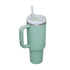 Thermos cup with handle and straw, insulated stainless steel tumbler, green color.