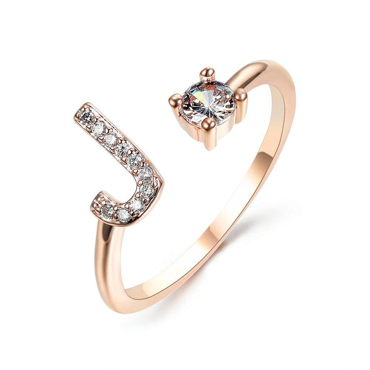 Elegant adjustable initial letter ring with zircon stones in copper alloy, fashionable jewelry design for women.