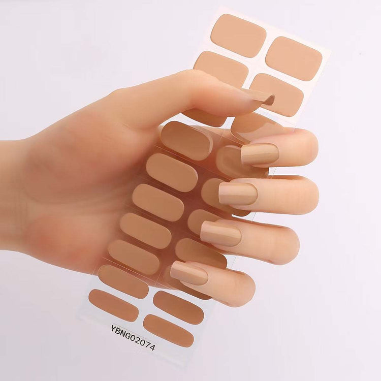 Gel nail stickers in assorted colors held by a hand, showcasing semi-curing and hardening features.