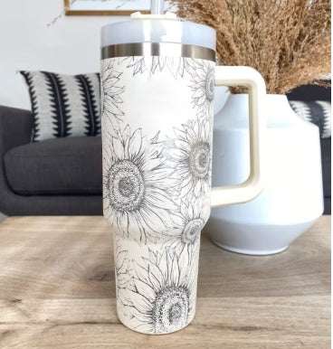 thermal cup with sunflower design, handle, and straw