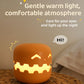 Pumpkin Lamp Bedside on a wooden table, providing a gentle warm light for a cozy atmosphere.